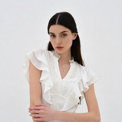 Woman in white ruffled blouse