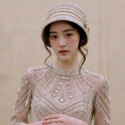 Asian woman in beaded cloche hat