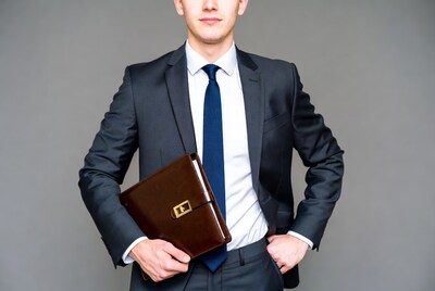 Businessman holding leather portfolio