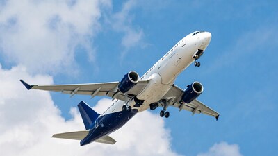 White Airplane Flying in Blue Sky