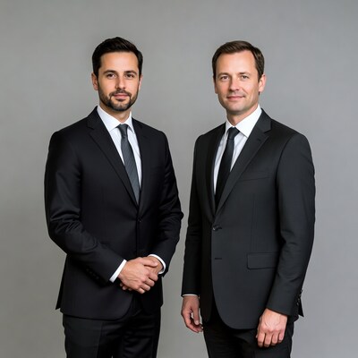 Two men shaking hands in suits