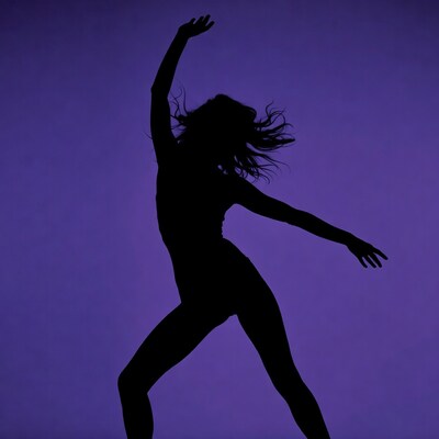 Woman dancing silhouette on purple background