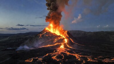 Erupting volcano with lava flows