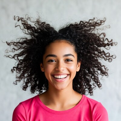 Smiling girl with curly hair