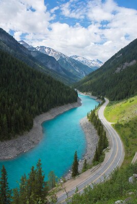 Turquoise River Winding Through Forested Mountains