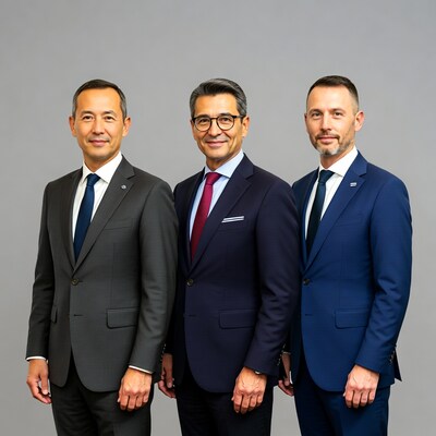 Three men in suits standing together