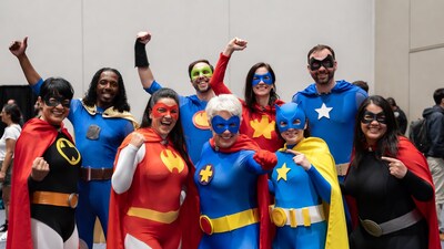 Group in superhero costumes posing together