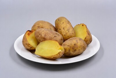 Baked potatoes on white plate