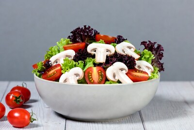 Fresh salad with mushrooms and tomatoes