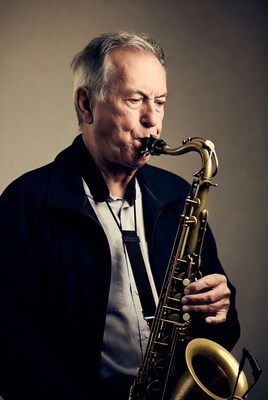 Elderly man playing saxophone