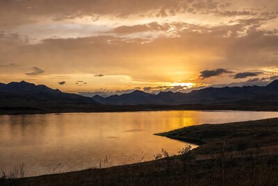 Sunset over lake and mountains