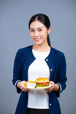 Asian woman holding burger plate