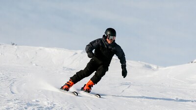 Man snowboarding down snowy slope