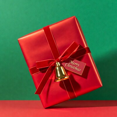 Red Christmas gift with bow and bell
