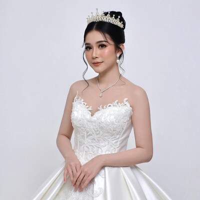 Asian bride in white lace gown with tiara
