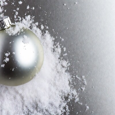 Silver Christmas ornament in snow