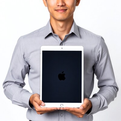 Asian man holding iPad