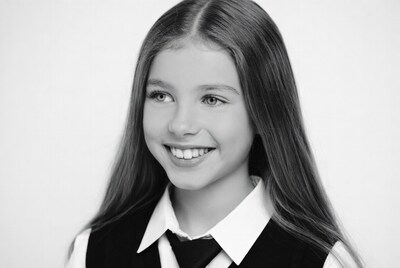 Smiling girl in school uniform