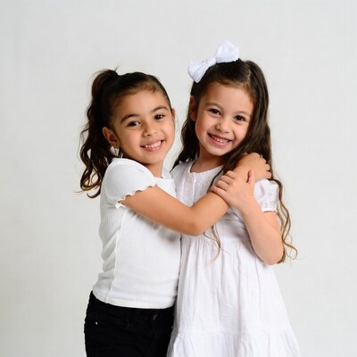 Two girls hugging and smiling