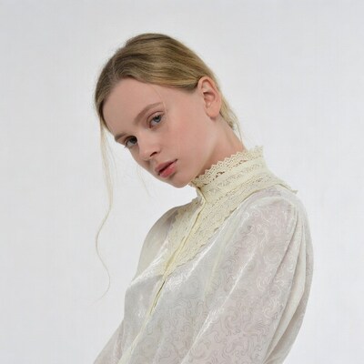 Blonde woman in lace collar blouse
