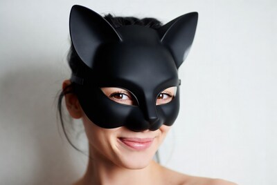 Woman wearing black cat mask