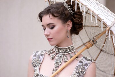 Woman with white umbrella and jewelry