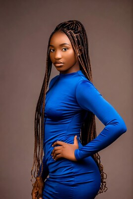African woman in blue dress with braids
