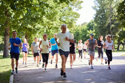 Group jogging in park path