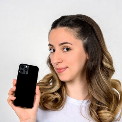 Young woman holding black iPhone