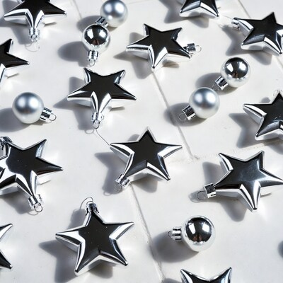 Silver Christmas Ornaments on White Wood