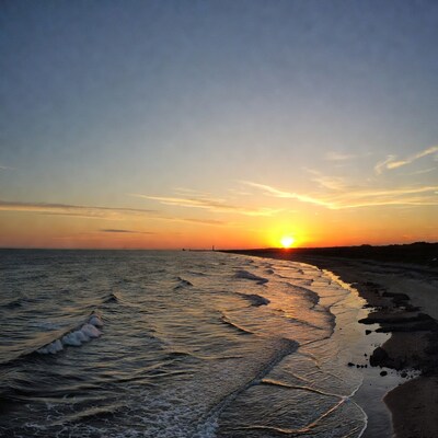 Sunset over beach and ocean