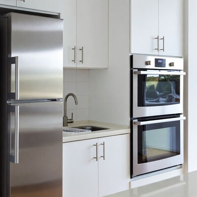 Modern white kitchen with stainless appliances