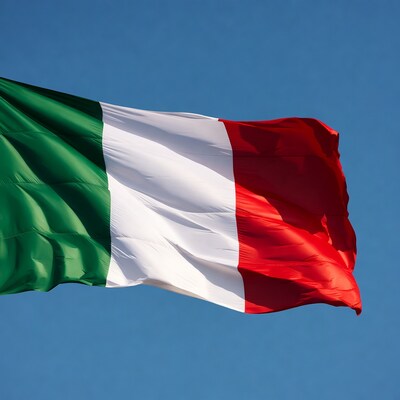 Italian Flag Waving Against Blue Sky