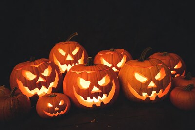 Group of lit jack-o-lantern pumpkins
