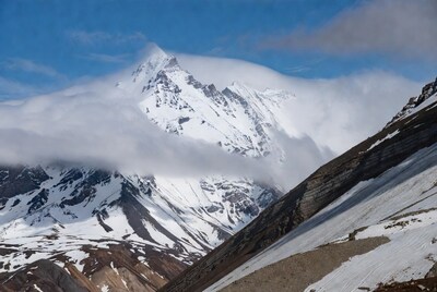 Snowy Mountain Peak in Clouds
