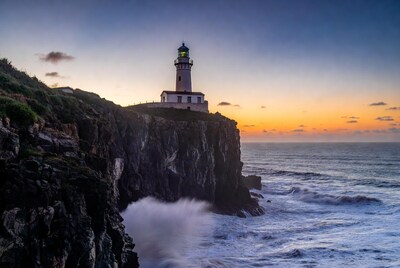 Lighthouse on Cliff at Sunset