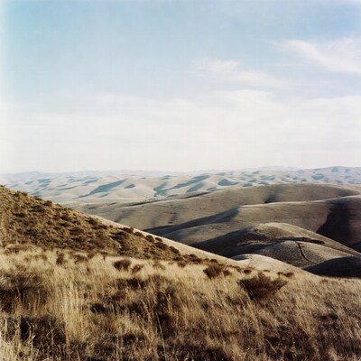 Rolling Hills Landscape with Blue Sky