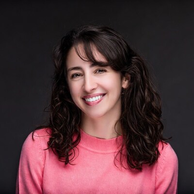 Smiling woman in pink sweater