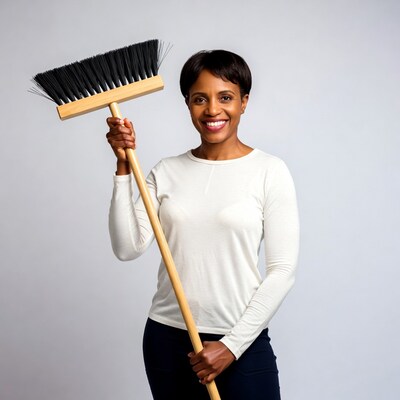 African-American woman holding broom