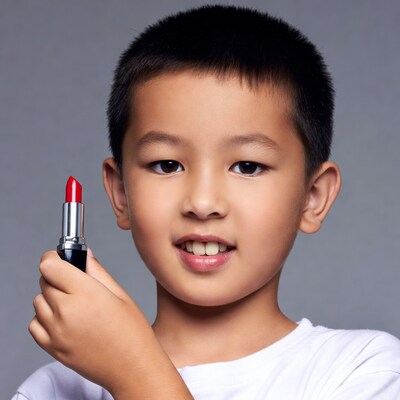 Asian boy holding red lipstick