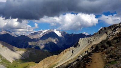 Alpine Mountains with Trail and Clouds