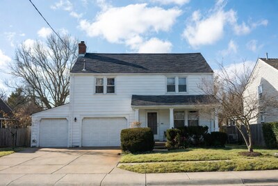 White two-story house with garage
