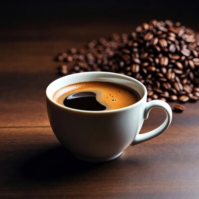 White cup of coffee with beans