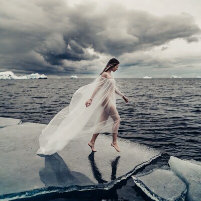 Woman walking on ice in sheer gown