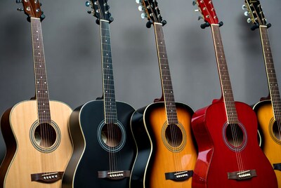 Colorful Acoustic Guitars Hanging on Wall