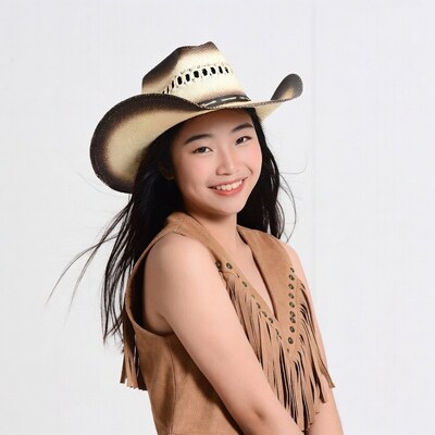 Asian girl in cowboy hat and vest