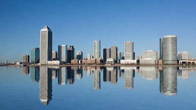 Skyscrapers reflected in calm water