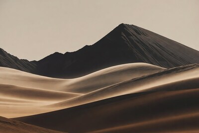 Sand Dunes with Dark Mountains