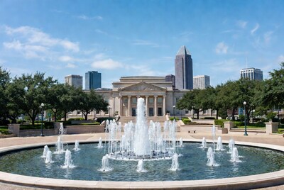 Fountain in front of museum and skyscrapers