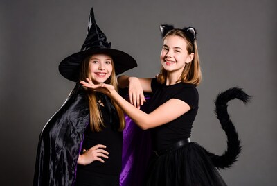 Girls in Witch and Cat Costumes